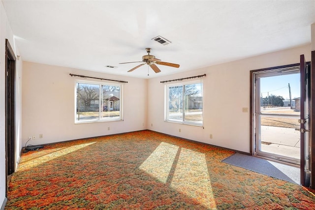 spare room with carpet and ceiling fan