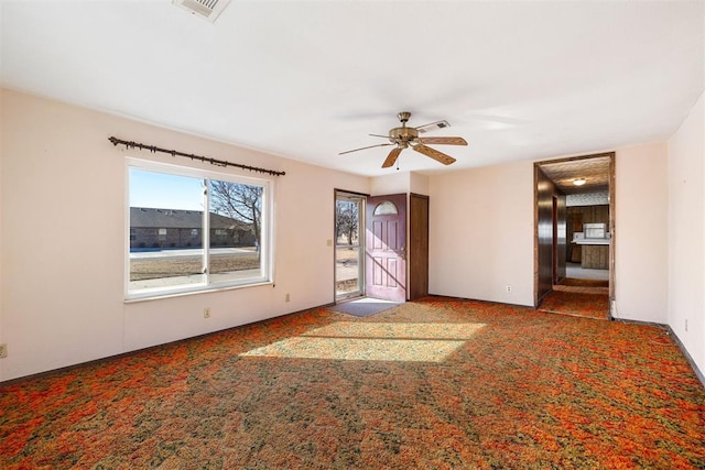 unfurnished room with carpet floors and ceiling fan