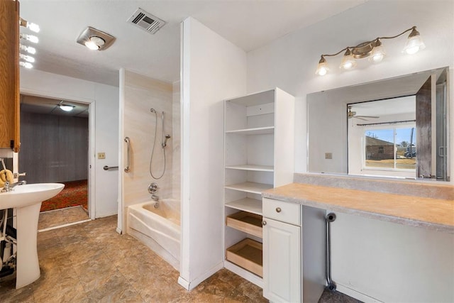 bathroom with shower / tub combination and sink