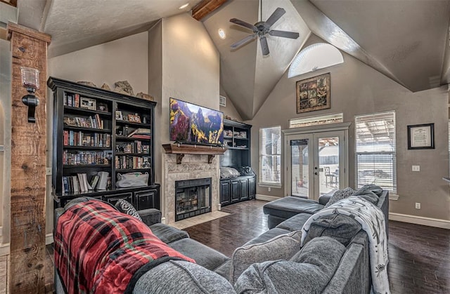 living room with french doors, a fireplace, dark hardwood / wood-style floors, and high vaulted ceiling