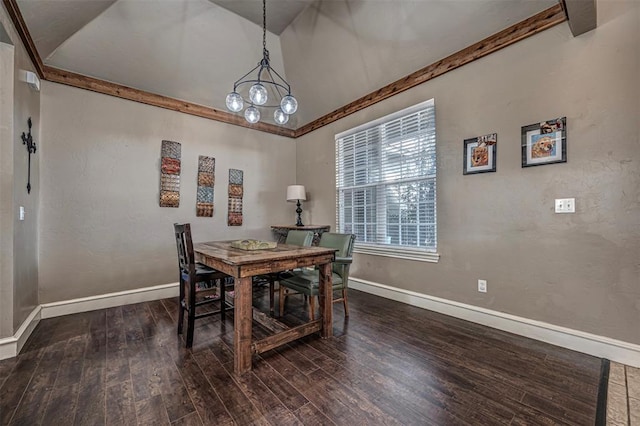 dining space with dark wood-type flooring, a chandelier, and vaulted ceiling