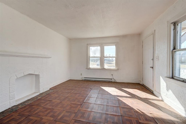 1801 E Madison St, Oklahoma City, OK 73111 - unfurnished living room featuring a baseboard heating unit and dark parquet flooring