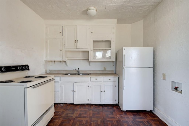 1801 E Madison St, Oklahoma City, OK 73111 - kitchen with white cabinetry, dark parquet floors, sink, white appliances, and a textured ceiling