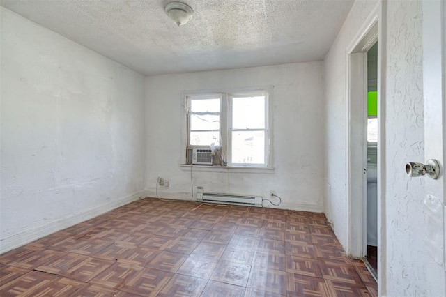1801 E Madison St, Oklahoma City, OK 73111 - empty room with dark parquet flooring, cooling unit, a baseboard radiator, and a textured ceiling