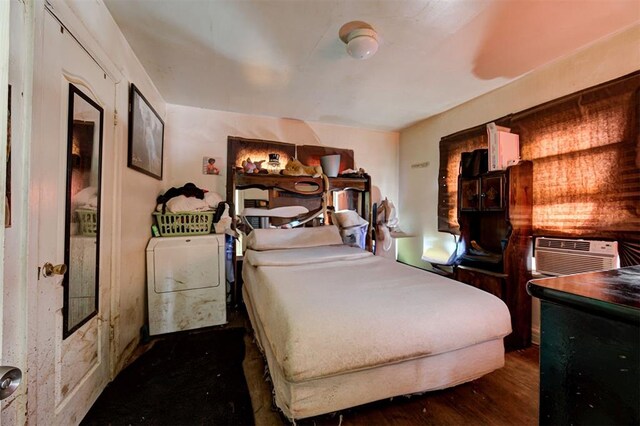 1801 E Madison St, Oklahoma City, OK 73111 - bedroom with dark hardwood / wood-style flooring and washer / clothes dryer