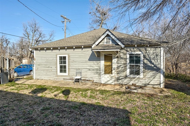1801 E Madison St, Oklahoma City, OK 73111 - back of property with a patio area and a lawn