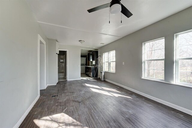 1801 E Madison St, Oklahoma City, OK 73111 - unfurnished living room with dark hardwood / wood-style flooring and ceiling fan