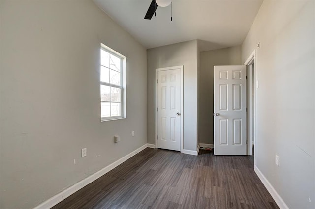 1801 E Madison St, Oklahoma City, OK 73111 - unfurnished bedroom with ceiling fan and dark hardwood / wood-style flooring