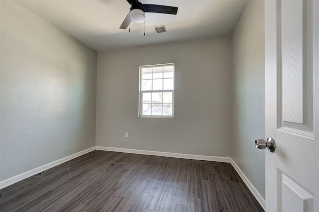 1801 E Madison St, Oklahoma City, OK 73111 - spare room with dark hardwood / wood-style floors and ceiling fan