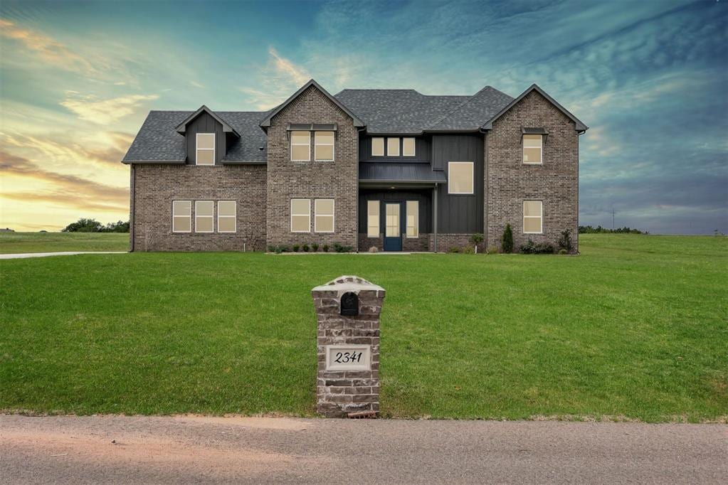 view of front of home with a lawn