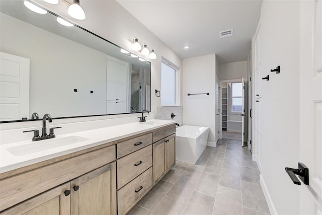 bathroom with vanity and tile patterned flooring