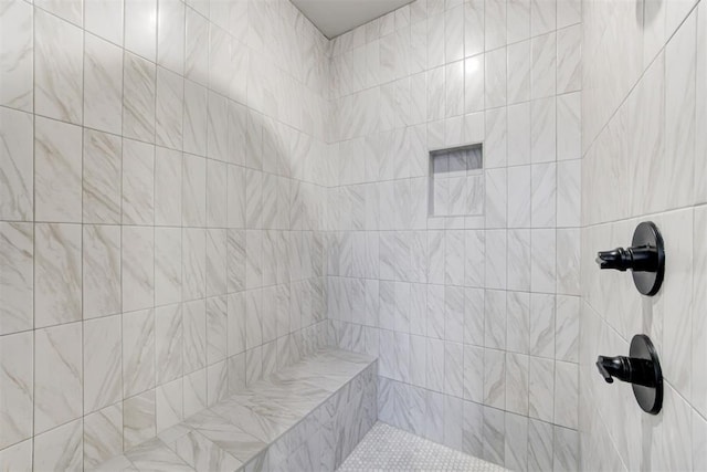 bathroom featuring tiled shower