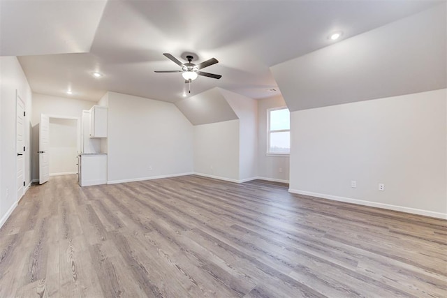 bonus room featuring ceiling fan, lofted ceiling, and light hardwood / wood-style flooring