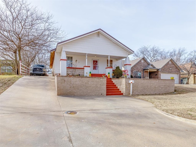 view of front facade with a garage and a porch