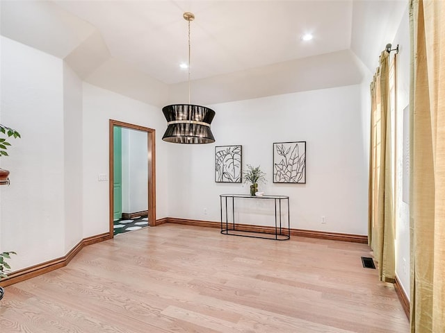 dining space with light hardwood / wood-style flooring