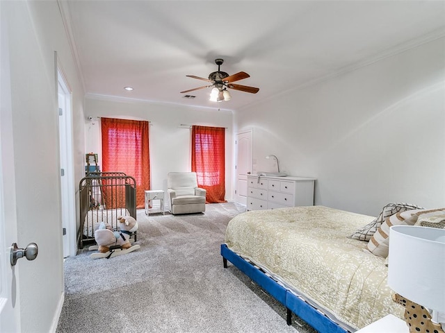 bedroom featuring ornamental molding, carpet, and ceiling fan