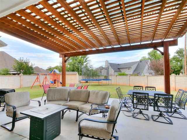 view of patio with a playground, outdoor lounge area, a trampoline, and a storage unit