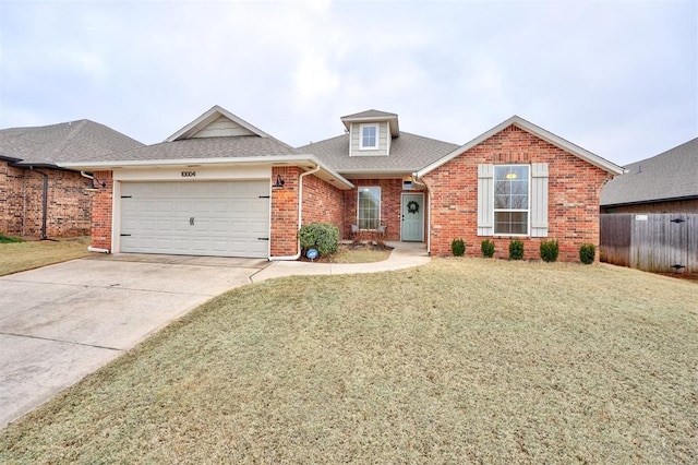 view of front of home with a garage and a front yard