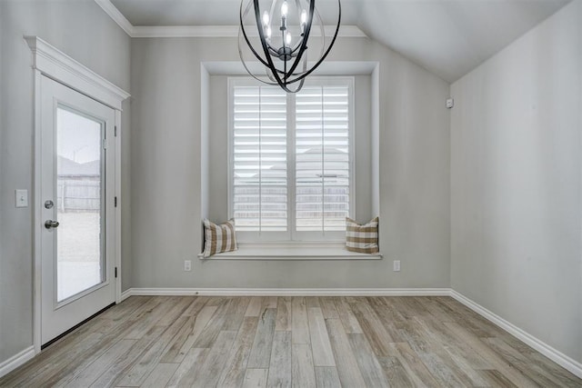 unfurnished dining area featuring crown molding, a notable chandelier, lofted ceiling, and light wood-type flooring