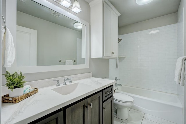 full bathroom with tiled shower / bath combo, vanity, and toilet