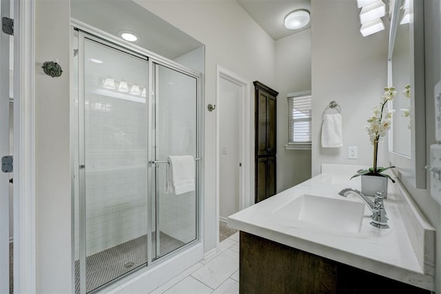 bathroom featuring vanity and an enclosed shower