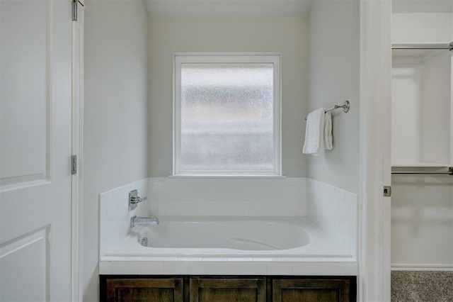 bathroom with tiled tub