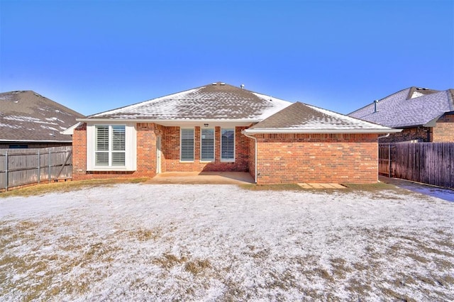 view of snow covered house