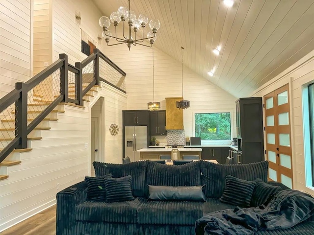 living room featuring dark hardwood / wood-style flooring, high vaulted ceiling, wood ceiling, and wood walls