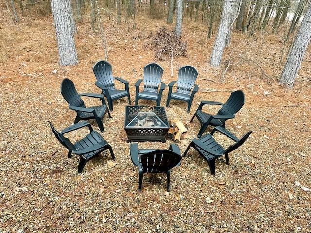 view of community with an outdoor fire pit