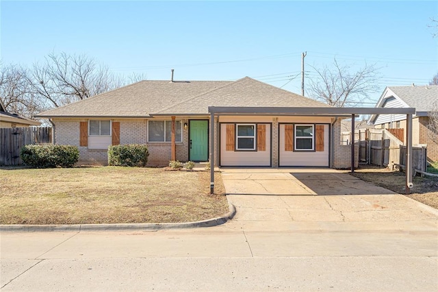 view of front facade with a carport and a front yard