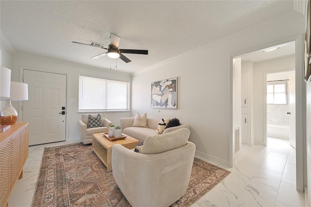 living room featuring ornamental molding, a textured ceiling, and ceiling fan