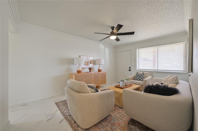 living room featuring ceiling fan, ornamental molding, and a textured ceiling