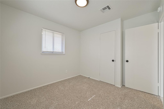 unfurnished bedroom with carpet flooring