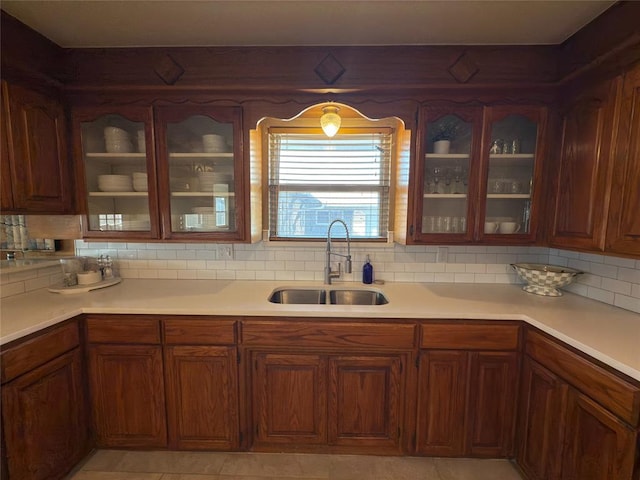 kitchen with sink and decorative backsplash