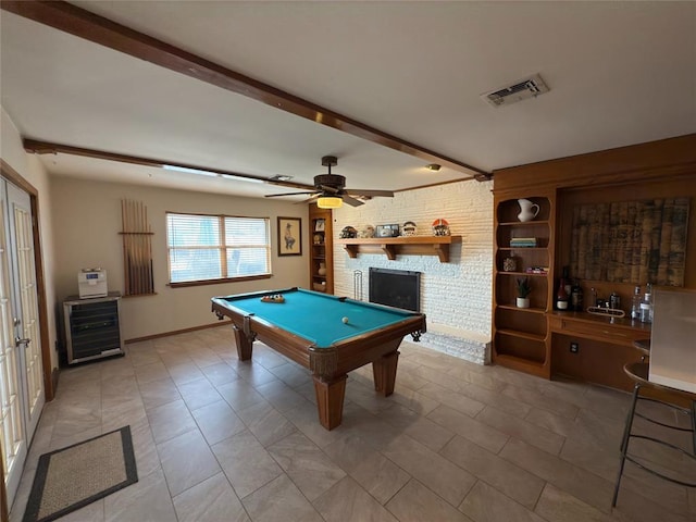 game room featuring ceiling fan, beam ceiling, a large fireplace, pool table, and beverage cooler