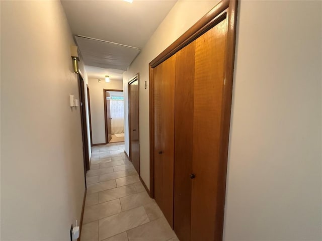 corridor featuring light tile patterned flooring