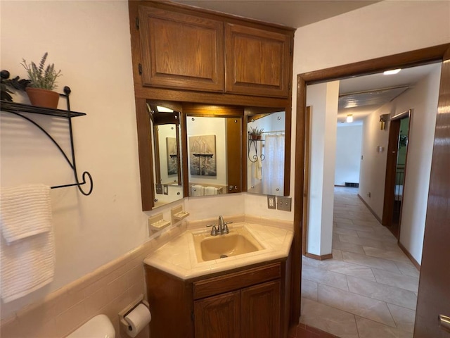 bathroom featuring tile patterned flooring and vanity