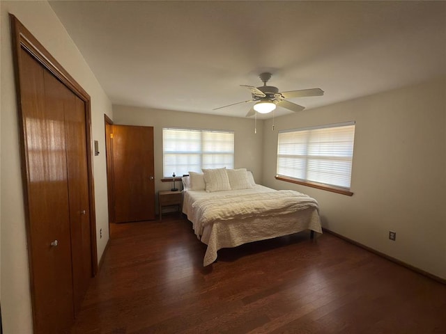 bedroom featuring ceiling fan and dark hardwood / wood-style floors