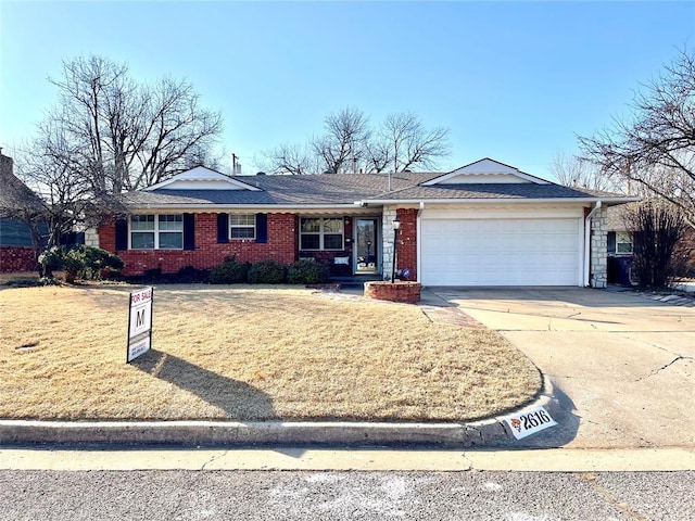 ranch-style house with a garage and a front yard