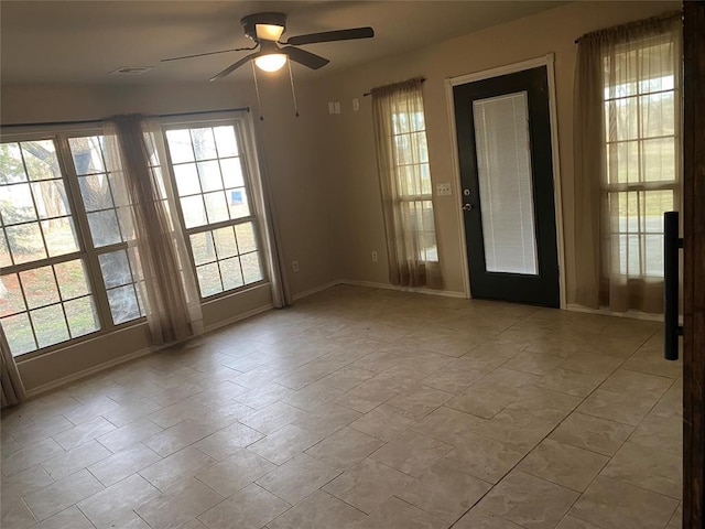 spare room with ceiling fan