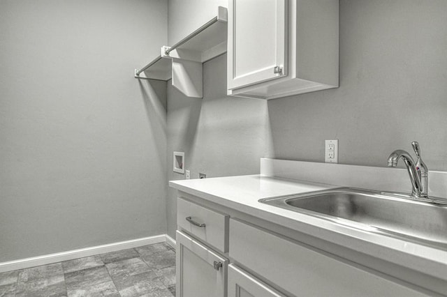 laundry room with cabinets, sink, and hookup for a washing machine