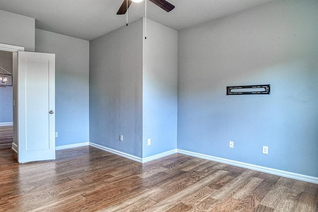 unfurnished room with hardwood / wood-style flooring and ceiling fan