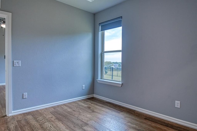 empty room with wood-type flooring