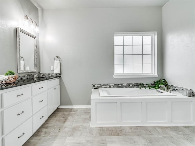 bathroom featuring vanity and a bathtub