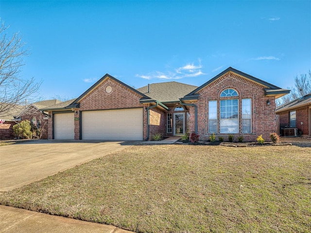 view of front of home featuring a garage and a front yard