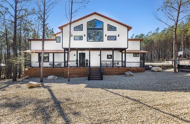 rear view of property with a porch