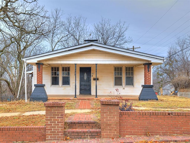 bungalow-style home with covered porch