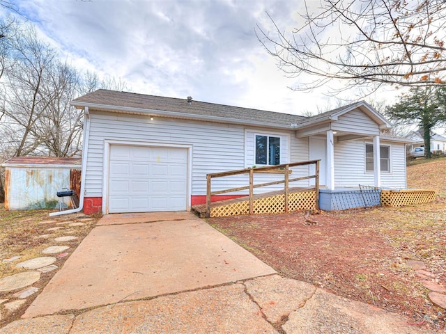 ranch-style home with a wooden deck and a garage