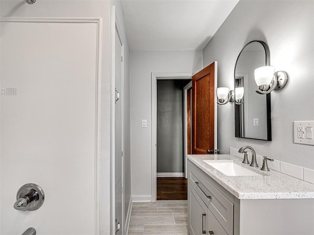 bathroom featuring shower / bathtub combination and vanity