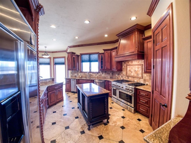 7 Country Club Rd, Shawnee, OK 74801 - kitchen with premium range hood, high end appliances, light stone counters, a center island, and backsplash